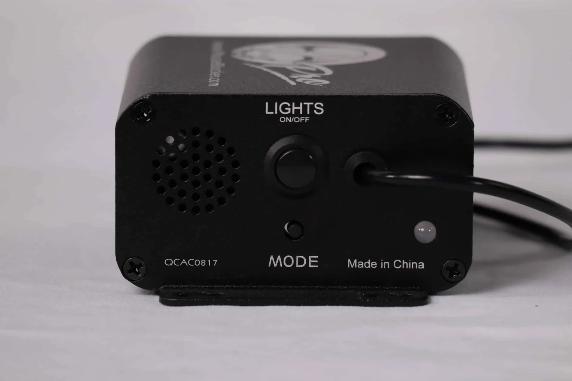 Black electronic device with buttons and cable.